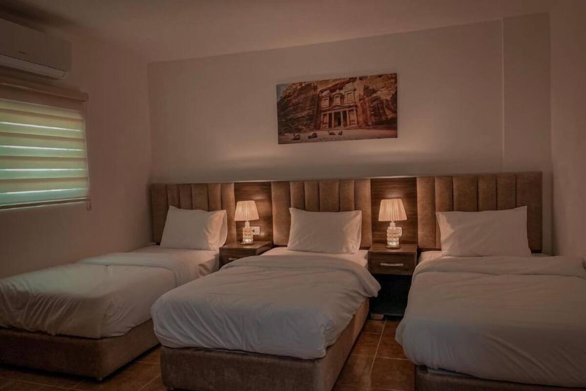 Deluxe Triple Room, Multiple Beds, Non Smoking | Minibar, in-room safe, blackout drapes, WiFi (free)