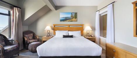 A bedroom with a large bed, two nightstands, a wooden headboard, a wall-mounted painting, a window with curtains, and a wooden dresser.