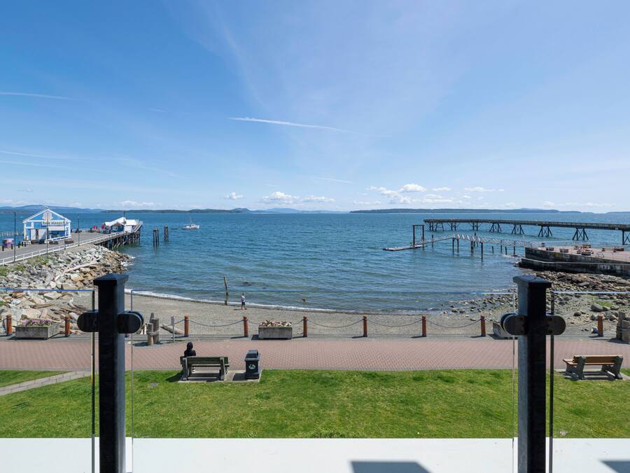 A waterfront view with a pier, benches, and a building labeled 'Fish Market'.
