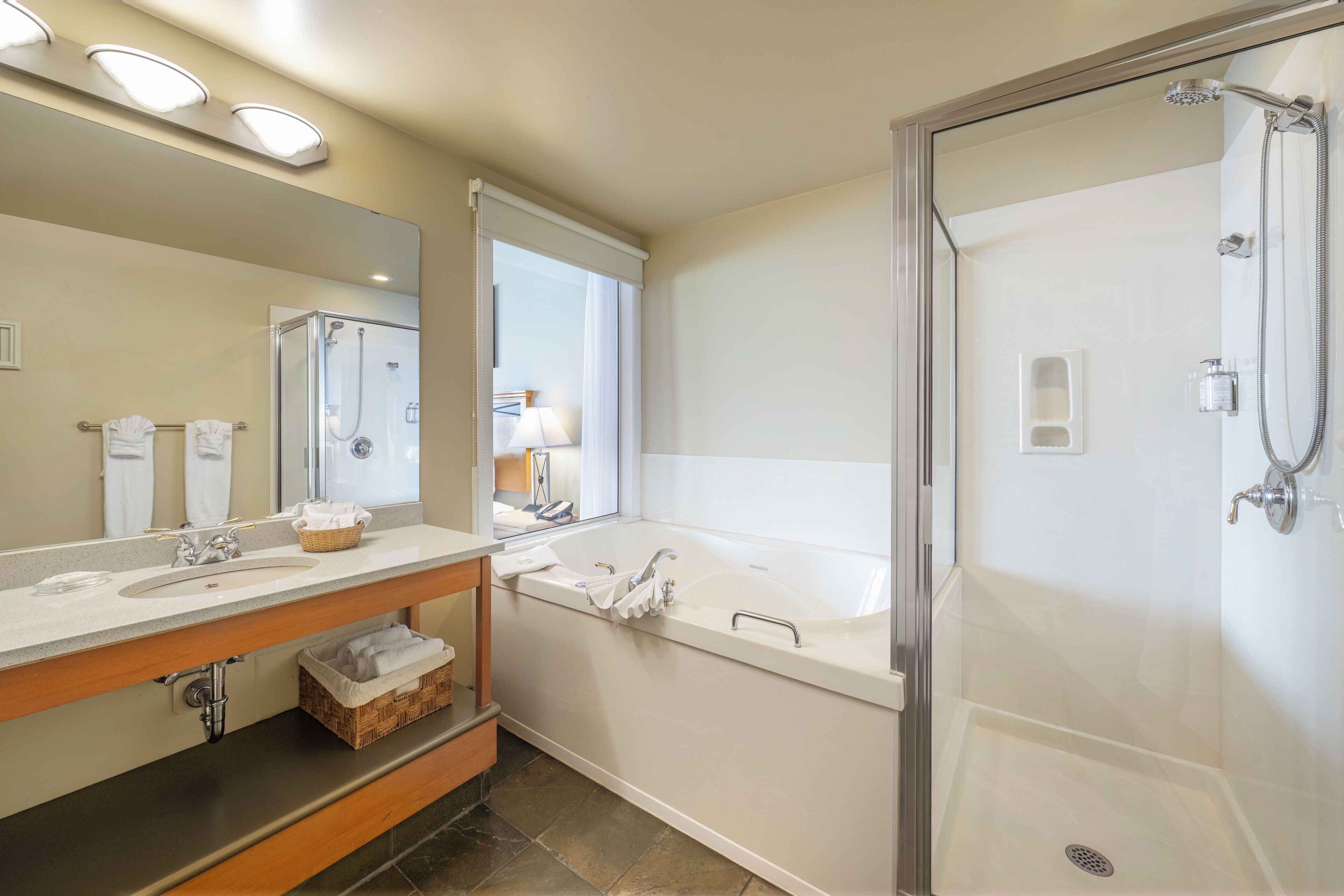 deluxe studio suite, 1 king bed, ocean view | bathroom | free toiletries, hair dryer, bathrobes, towels