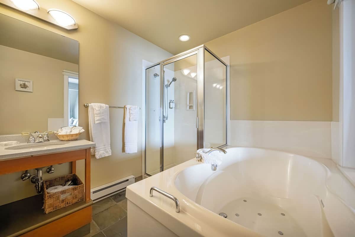 deluxe studio suite, 1 king bed with sofa bed, ocean view | bathroom | free toiletries, hair dryer, bathrobes, towels