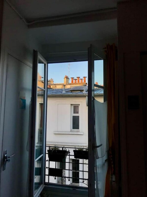 Step outside to a balcony with a view of the surrounding area.