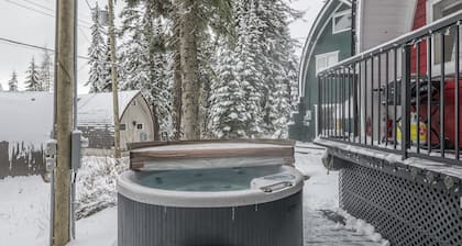 Renovated cozy cabin in sought after location with private hot tub and laundry.