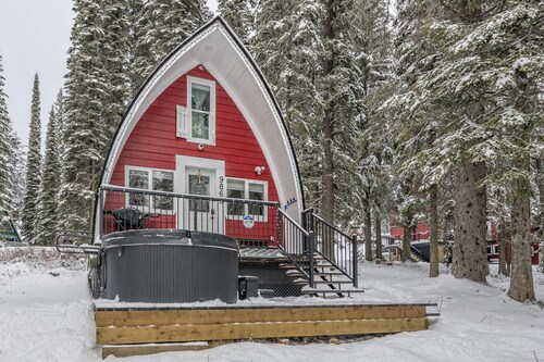 Renovated cozy cabin in sought after location with private hot tub and laundry. 