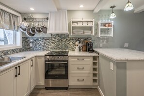 Fridge, microwave, oven, stovetop - Renovated cozy cabin in sought after location with private hot tub and laundry.  (Silver Star Mountain)