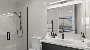 Shower, hair dryer, towels, shampoo