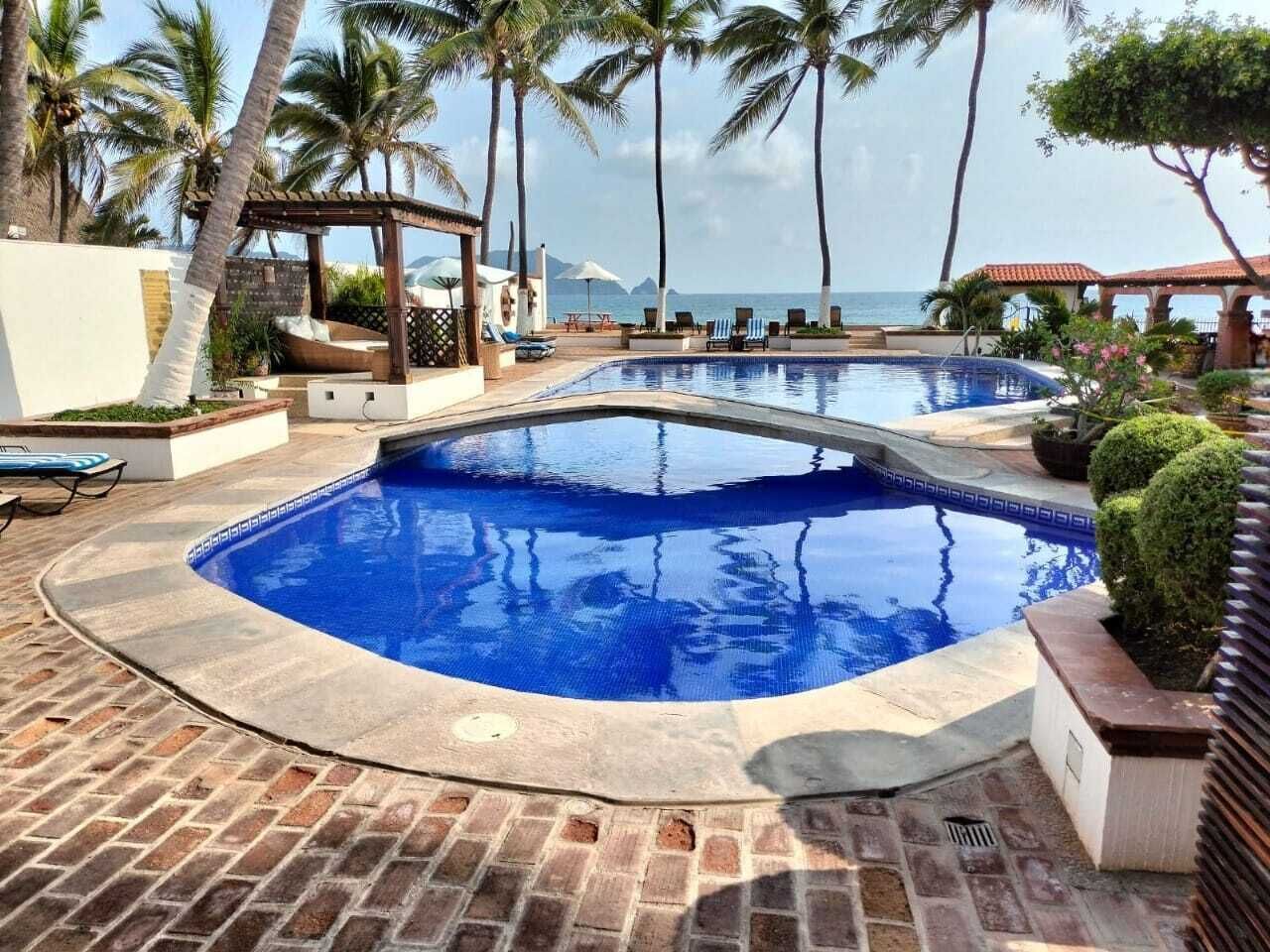 Outdoor pool, open 9:30 AM to 9:00 PM, pool umbrellas