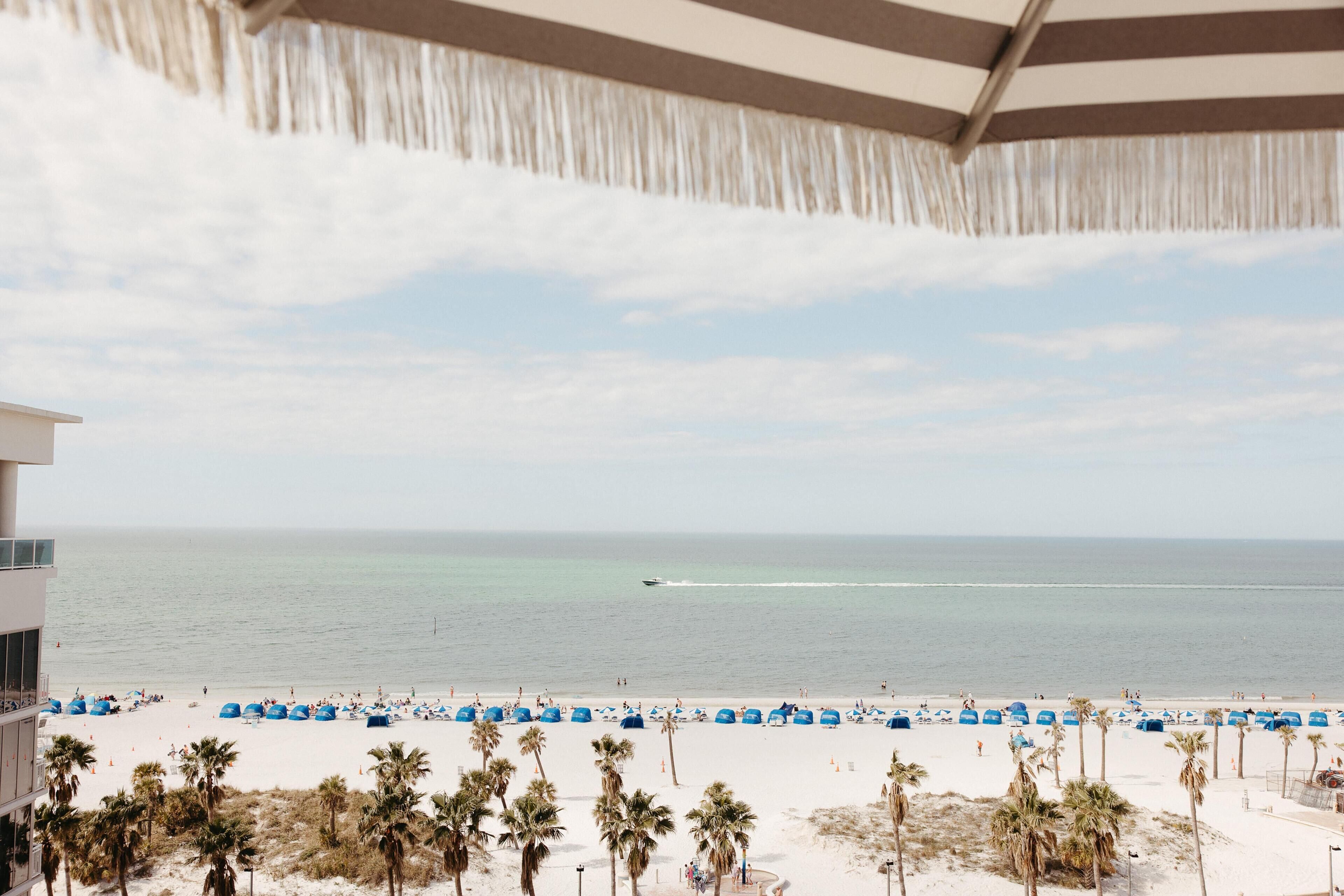 Beach nearby, white sand, beach towels