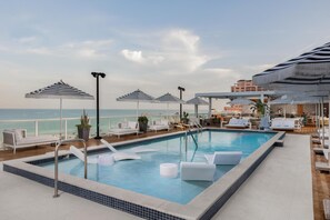 Outdoor pool, open 8:00 AM to 10:00 PM, pool umbrellas, sun loungers