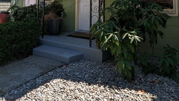 A house with a green exterior, a white door, and a number 149 on the front. - 2BR Craftsmen Greenlake Home + Backyard + Firepit (Seattle)