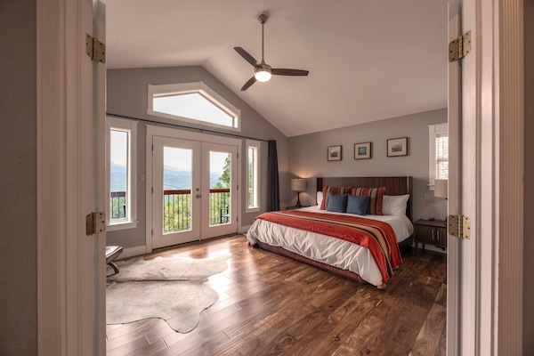 Primary bedroom (3rd floor) with 65" smart TV and stunning mountain views