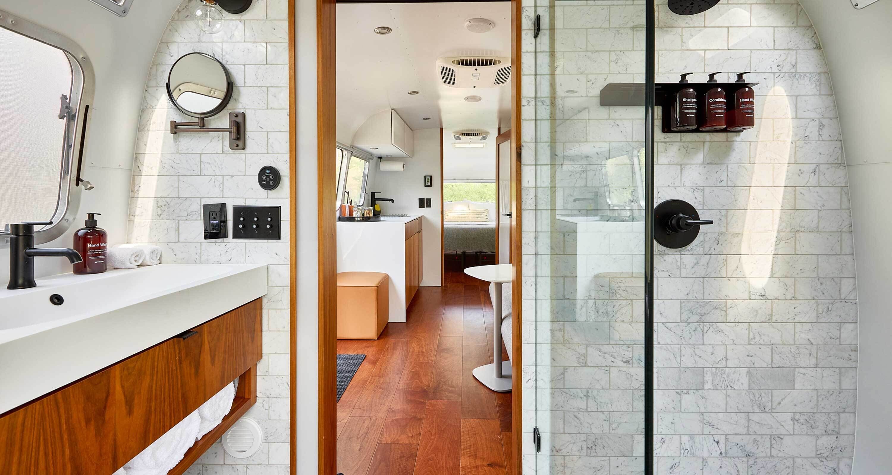 Suite (Airstream) | Bathroom | Shower, designer toiletries, hair dryer, towels