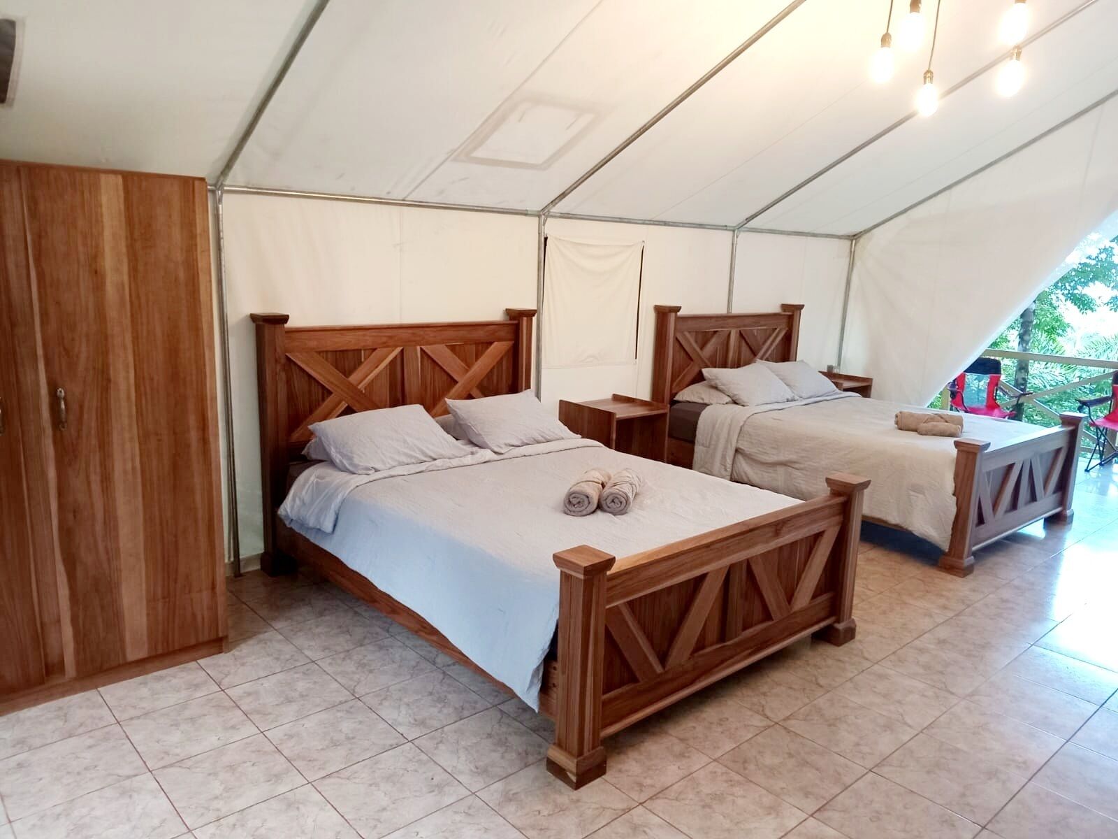 Luxury Tent W/ Exterior Connected Toilet Room & Shared Exterior Lockable Bathroom Across From Tent | Tempur-Pedic beds, individually furnished, free WiFi, bed sheets