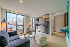 Apartamento exclusivo | Área de estar | Smart TV 40 polegadas com canais a cabo