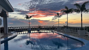 2 outdoor pools, open 8:00 AM to 9:00 PM, pool loungers