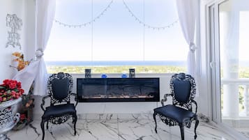 PENTHOUSE LUXURY SUITE, Romantic Penthouse | Living area | 55-inch TV with digital channels