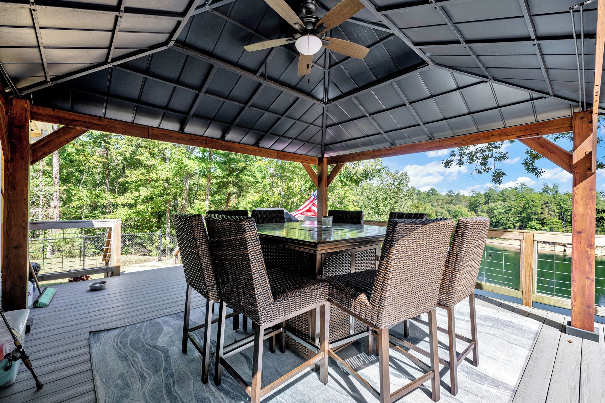 This fire table comfortably seats 8 and the gazebo is right outside the kitchen.