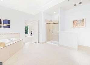 A modern hotel lobby with a reception desk, a glass shower area, and a painting on the wall. - Dream House (Alexandria)