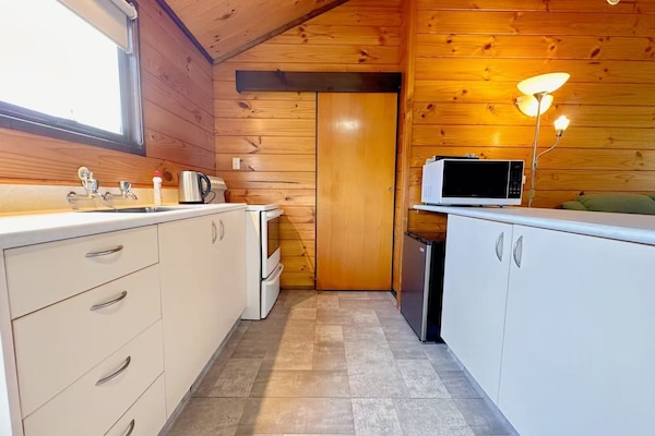 Mini-fridge, oven, stovetop, electric kettle
