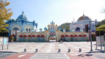 A large, colorful building with a central archway labeled "Disney World."