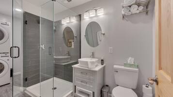 Shower, towels, soap, toilet paper