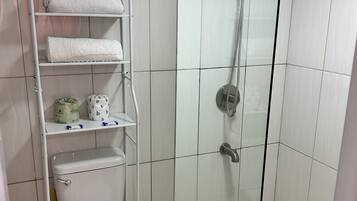 Shower, towels, soap, toilet paper