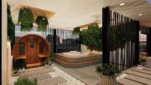 A modern spa area with a wooden sauna, a hot tub, and lush greenery. - Posto Dormire Benhil (Jakarta)