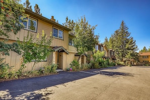 A row of two-story buildings with a parking lot in front. - Walk to beach, HOA amenities - 3 Bears, Tahoe City, (Tahoe City)