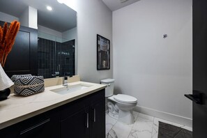 Shower, hair dryer, towels, shampoo