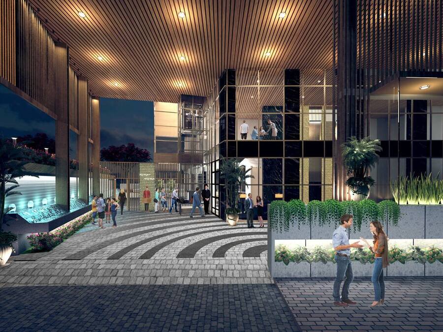 A modern building with a glass facade, a wooden ceiling, and a landscaped area with plants.
