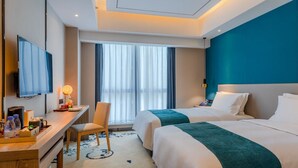 A hotel room with two beds, a desk with a chair, a flat-screen TV, and a large window with curtains. - Ginlan jia hotel Hangzhou Xintiandi (Hangzhou)