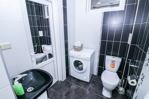 Classic Condo | Bathroom | Shower, hair dryer, slippers, towels - Stay Inn on Saryan 2 (Yerevan)