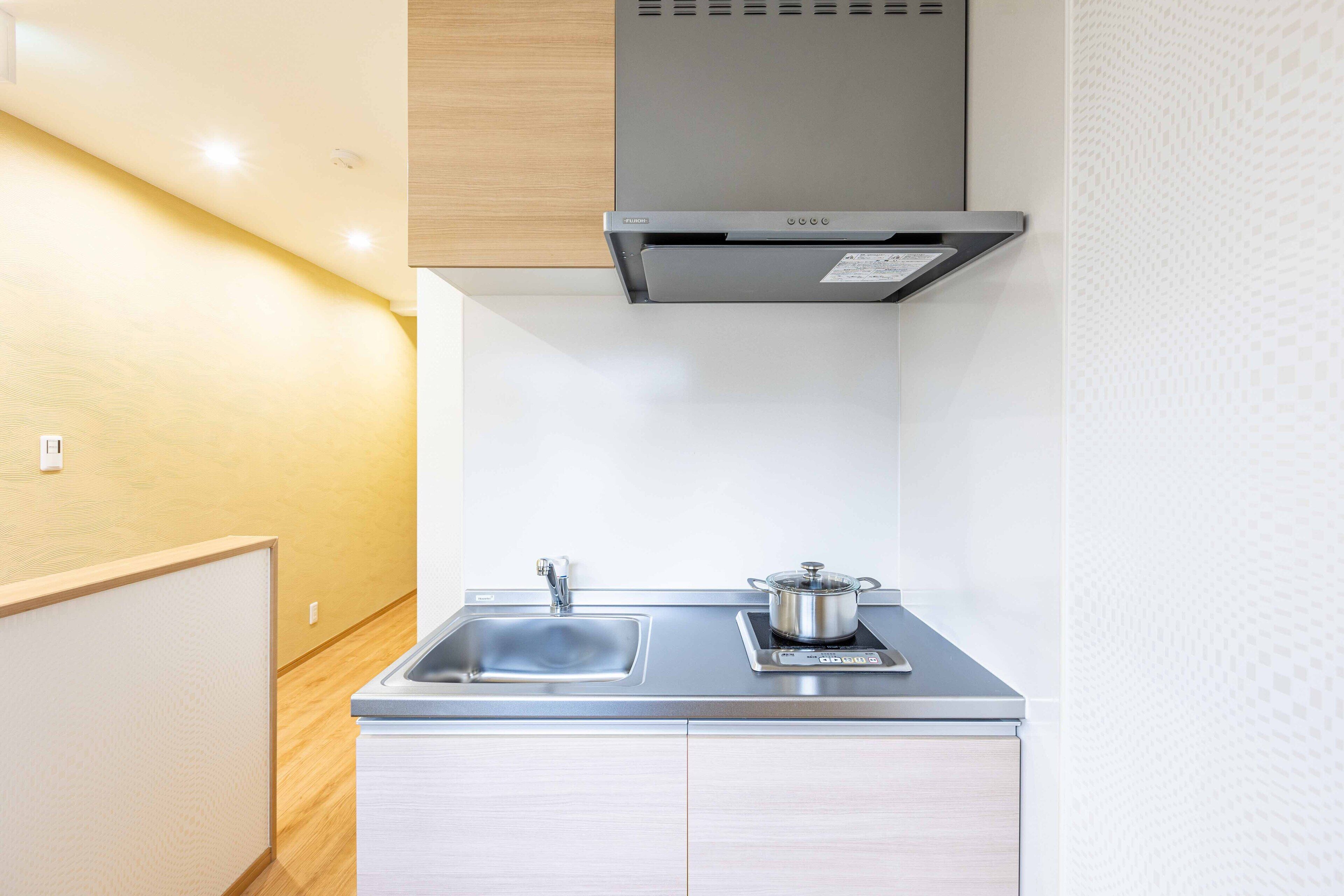 Full-size fridge, microwave, stovetop, electric kettle