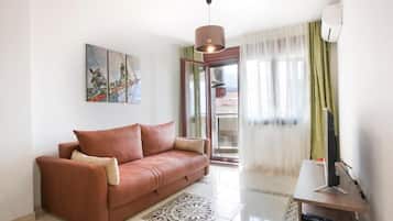 Family Apartment | Living area | 32-inch LCD TV with cable channels