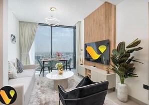 Luxury Apartment | Living area | 65-inch Smart TV with cable channels