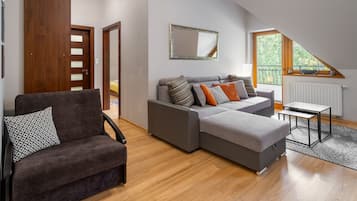 Comfort Apartment | Living area | 37-inch flat-screen TV with digital channels