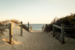 A sandy beach path leading to the sea with wooden railings on both sides. - Rosa 3 is located a stones throw from SOuth Beach and the many restaurants and cafes South Fremantle has to offer (South Fremantle)