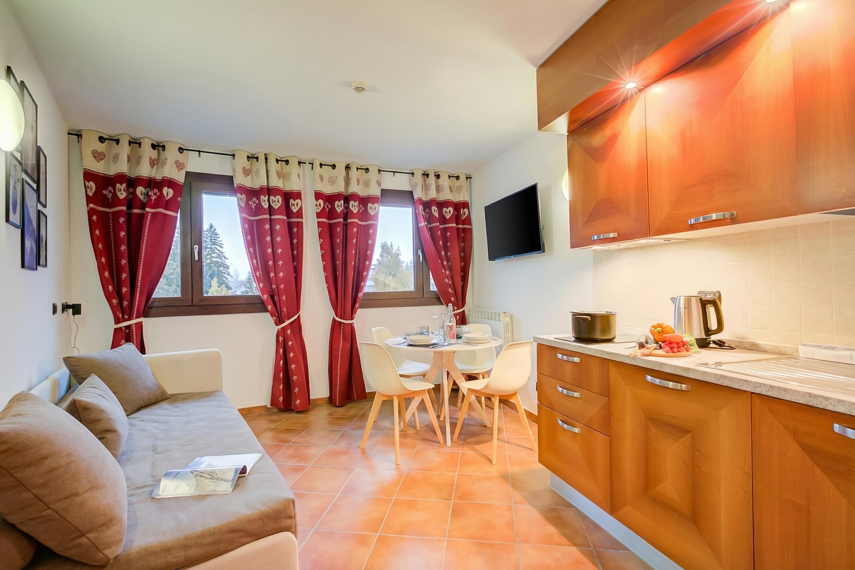 Family Apartment, 1 Bedroom (L'aquila Ski in / ski out) | Living area | TV