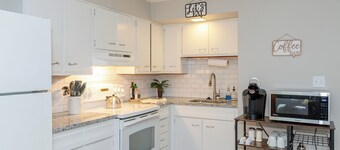 Stylish 2BR retreat on 2nd FL 1 block from The Greene. Modern vibes, Gigabit WiFi, and private garage. Ideal for UD, WPAFB, and traveling professionals.