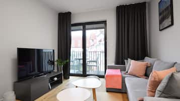 Comfort Apartment | Living room | 27-inch flat-screen TV with satellite channels