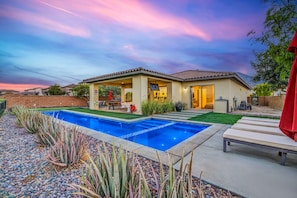 A residential property with a swimming pool, patio furniture, and a covered outdoor area. - Desert Chill: Pool & Spa at PGA West Stadium (La Quinta)