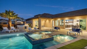 A residential property with a swimming pool, outdoor seating, and a modern kitchen. - Poolside Paradise | Fire Pit & Golf Next Door (La Quinta)