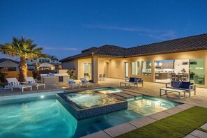 A residential property with a swimming pool, outdoor seating, and a modern kitchen. - Poolside Paradise | Fire Pit & Golf Next Door (La Quinta)