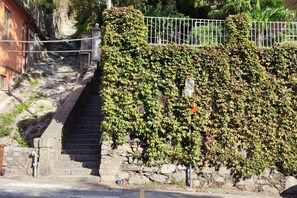 Staircase leads up to a historic building with a traditional stone design.