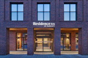 A brick building with a sign reading "Residence Inn by Marriott".