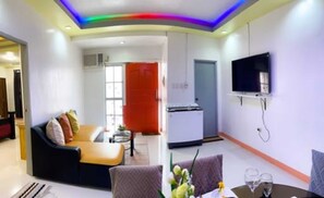 Exclusive Condo, 2 Bedrooms | Living room | 49-inch Smart TV with digital channels, Netflix, streaming services - RB Modern Condos (Zamboanga)