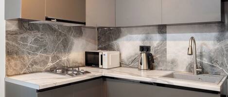 Fridge, microwave, stovetop, coffee/tea maker