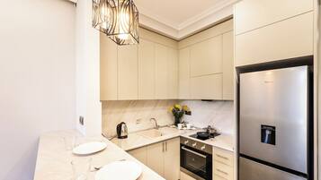 Fridge, microwave, stovetop, coffee/tea maker