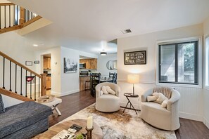 A spacious living room with a staircase, a dining area, and a kitchen. - 37c Hidden Creek Mountain Getaway! 3 Bedroom Condo by RedAwning (Park City)