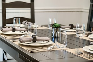 A dining table set with plates, cutlery, glasses, and napkins. - 37c Hidden Creek Mountain Getaway! 3 Bedroom Condo by RedAwning (Park City)